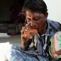 A Chinese Man Eats Nails, While an Indian Man Eats Bricks